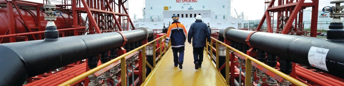 Shell employee walking along on a tanker