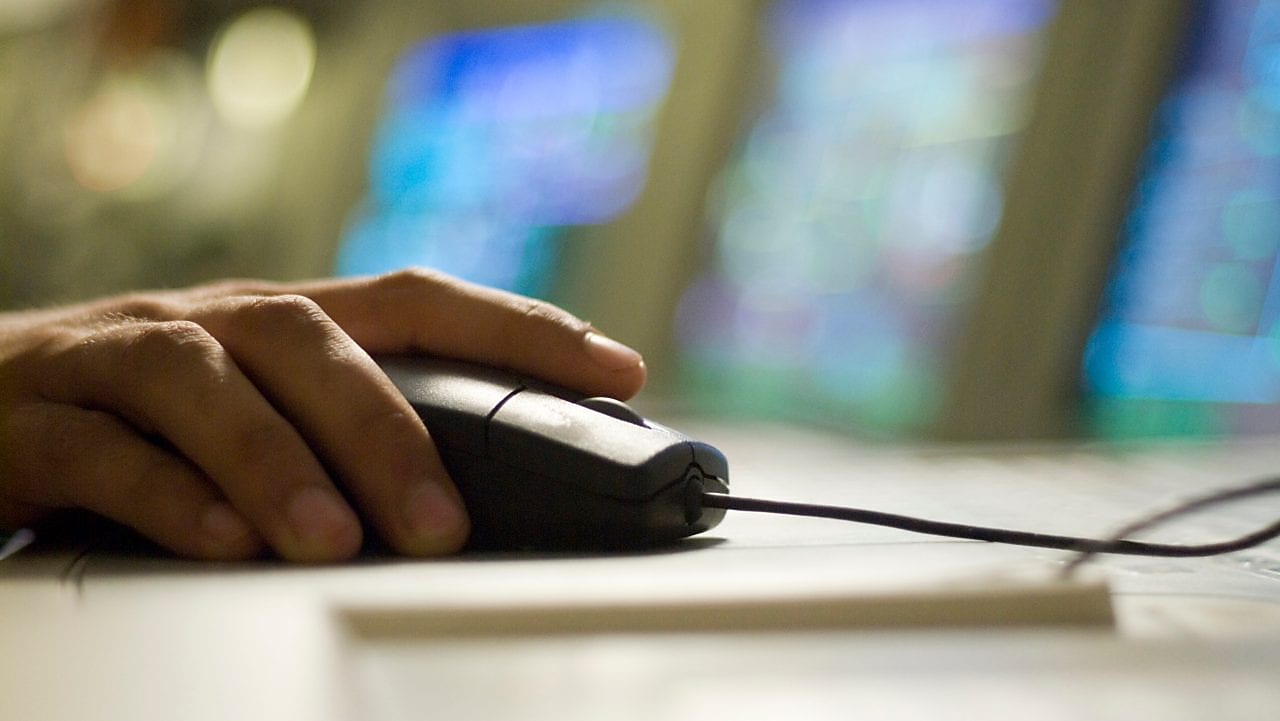 person clicking the computer mouse