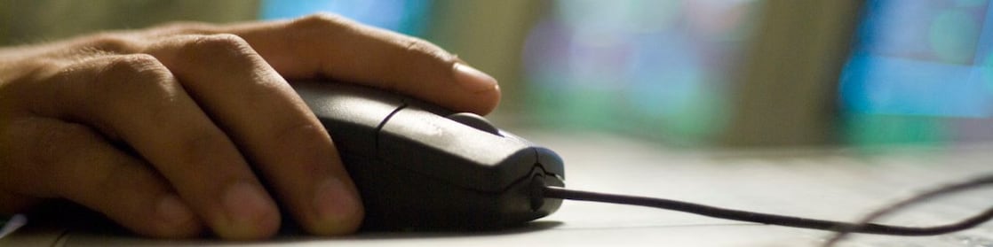 person clicking the computer mouse