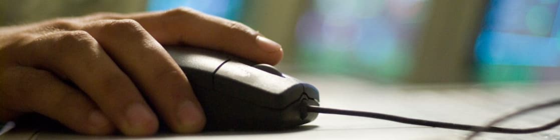 person clicking the computer mouse