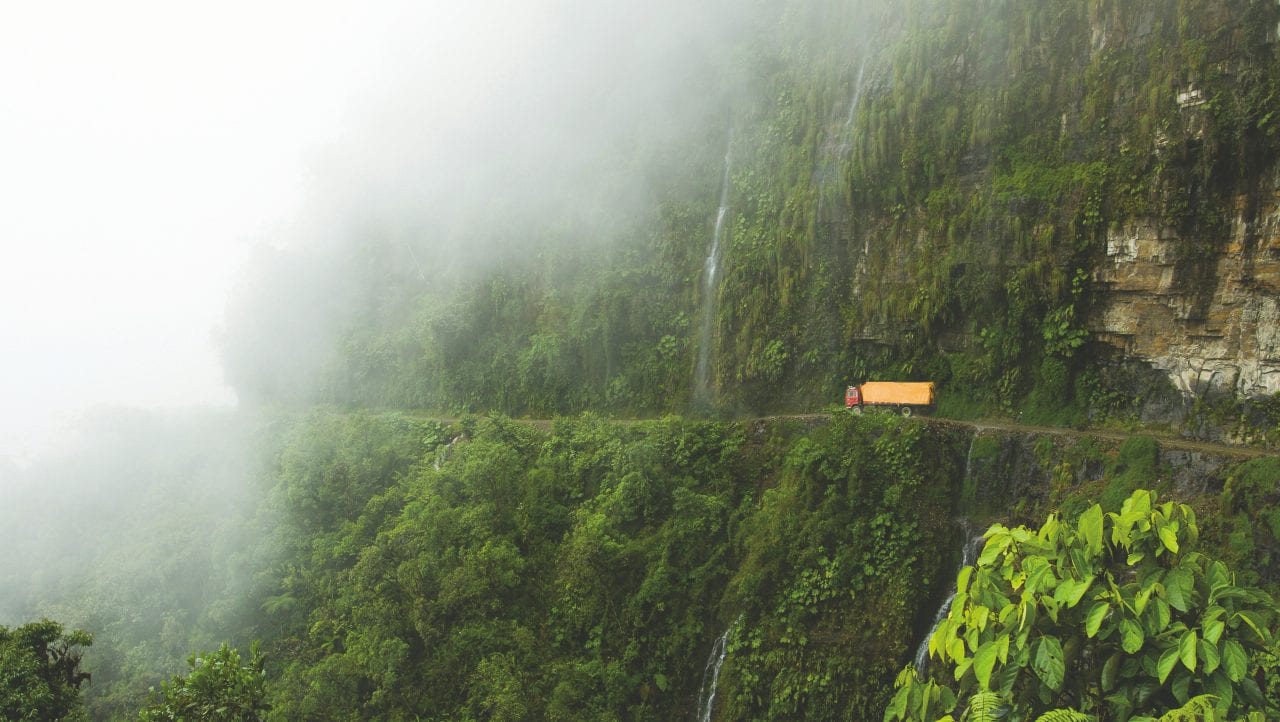Truck on jungle mountainside