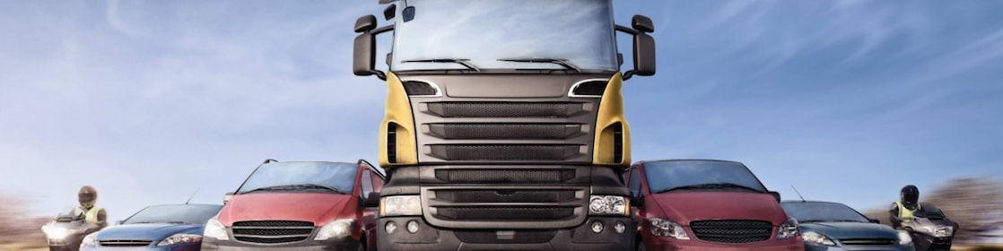 Cars and trucks in line on the road