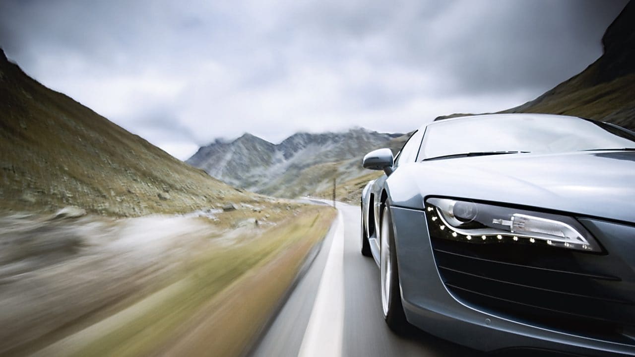 car driving along a winding mountain road