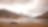 Car on the road by a mountain lake