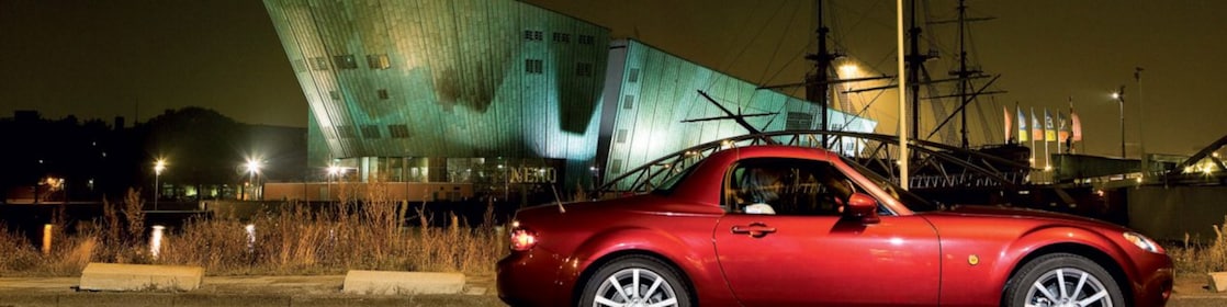 Red car parked on the streets of Amsterdam