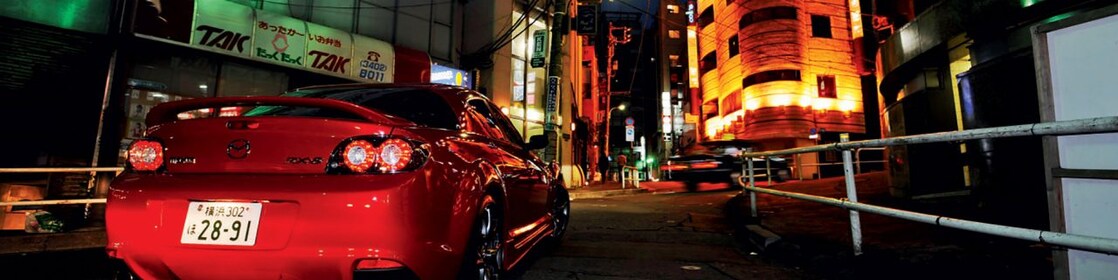 Mazda driving at night in Tokyo