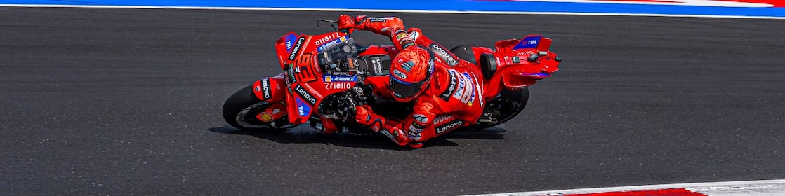 A man driving a motorcycle using extraordinary engine oil.