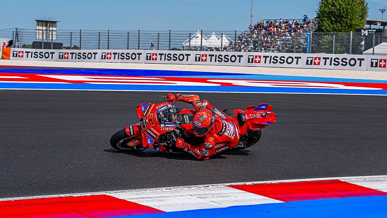 A man driving a motorcycle using extraordinary engine oil.