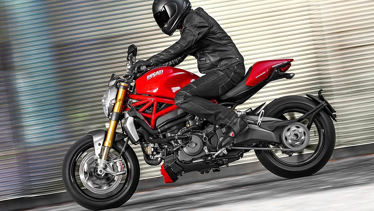 A man driving a motorcycle using extraordinary engine oil.