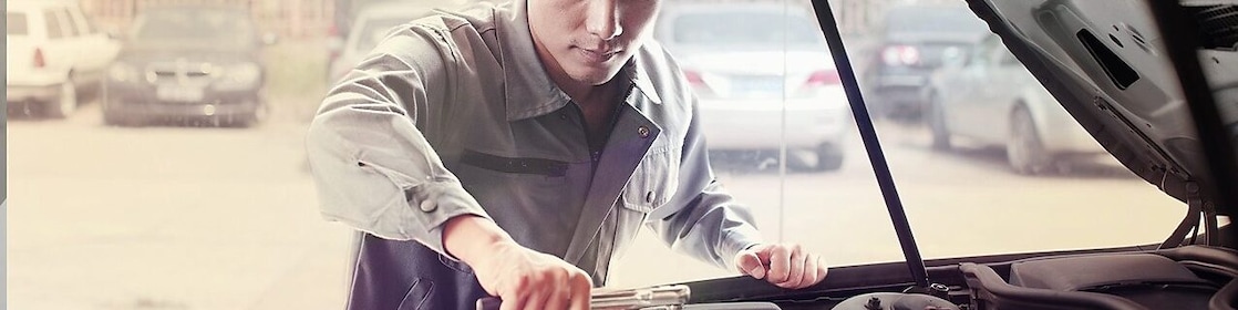 Mechanic fixing a car