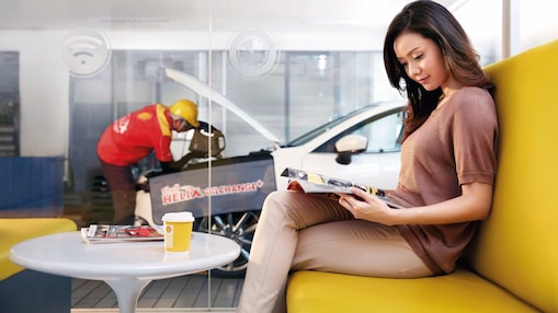 women sitting inside customer lounge