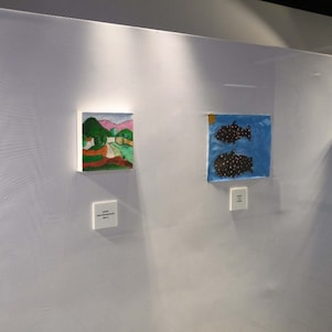 Painting on stand in glass room art exhibition