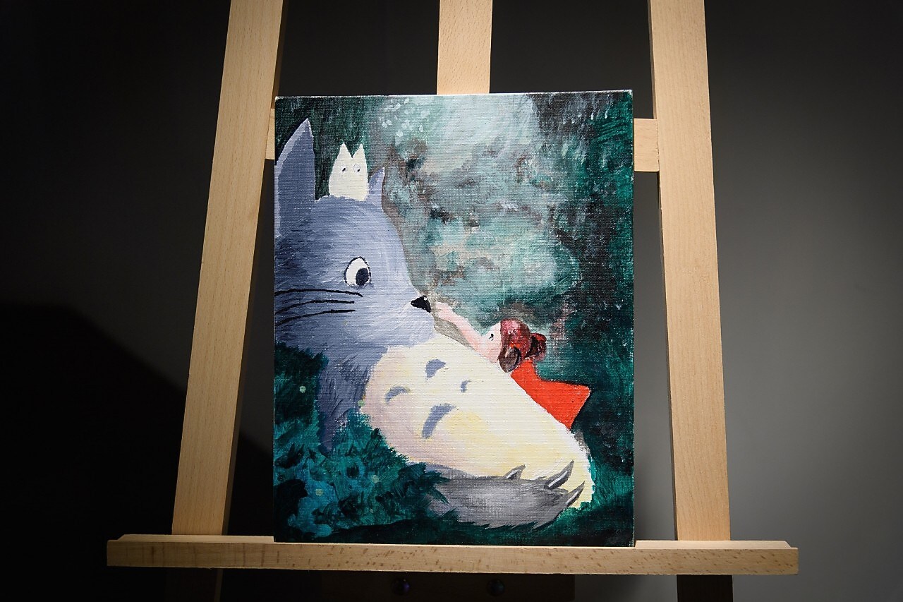 Painting of cat and little girl