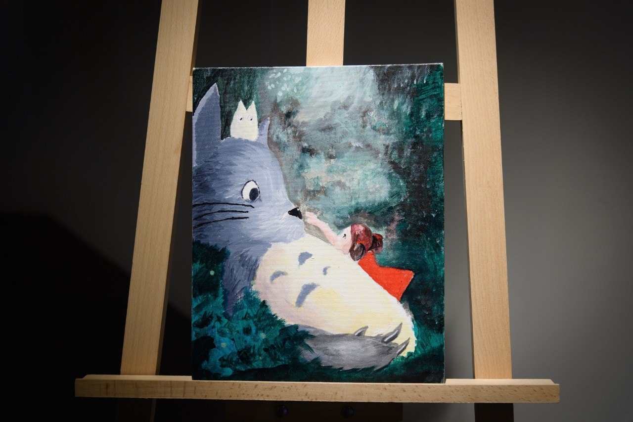 Painting of cat and little girl