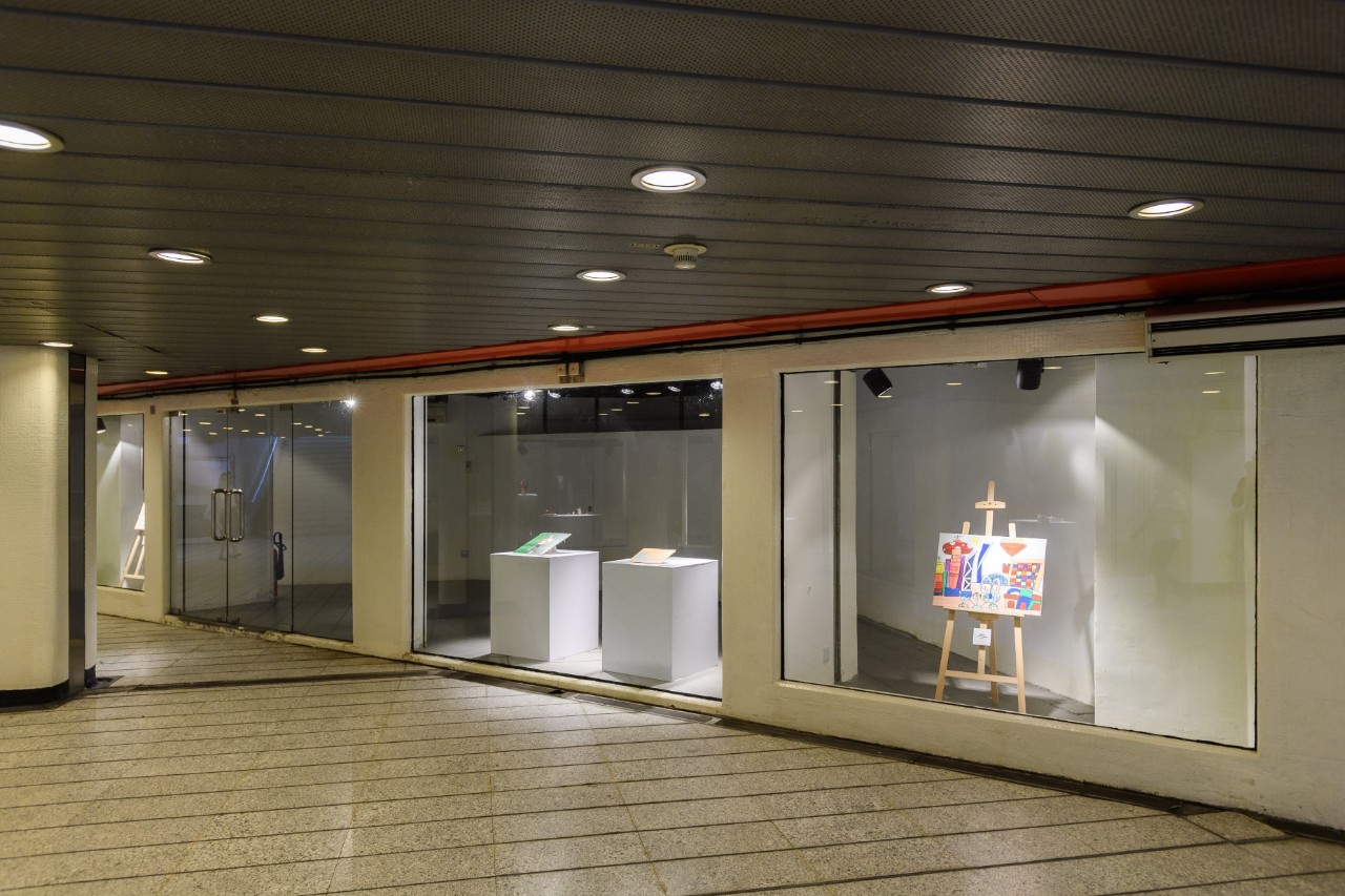 Painting in glass room at art exhibition