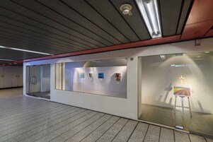Painting in glass room at art exhibition