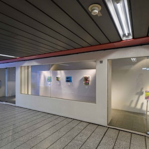 Painting in glass room at art exhibition