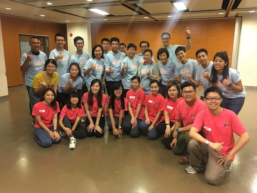 Group photo of volunteers and TREATS, a children social integration organization.