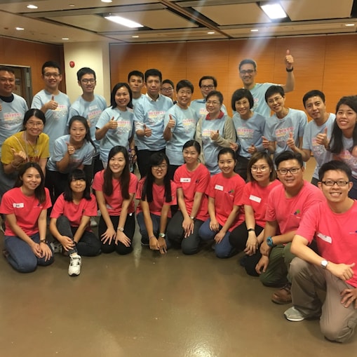 Group photo of volunteers and TREATS, a children social integration organization.