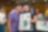 Student with special educational needs and parent took photo with painting.