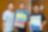 Students with special educational needs and volunteer took photo with paintings.