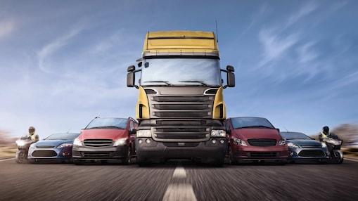 Cars and trucks in line on the road