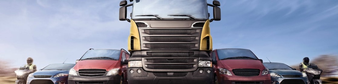 Cars and trucks in line on the road