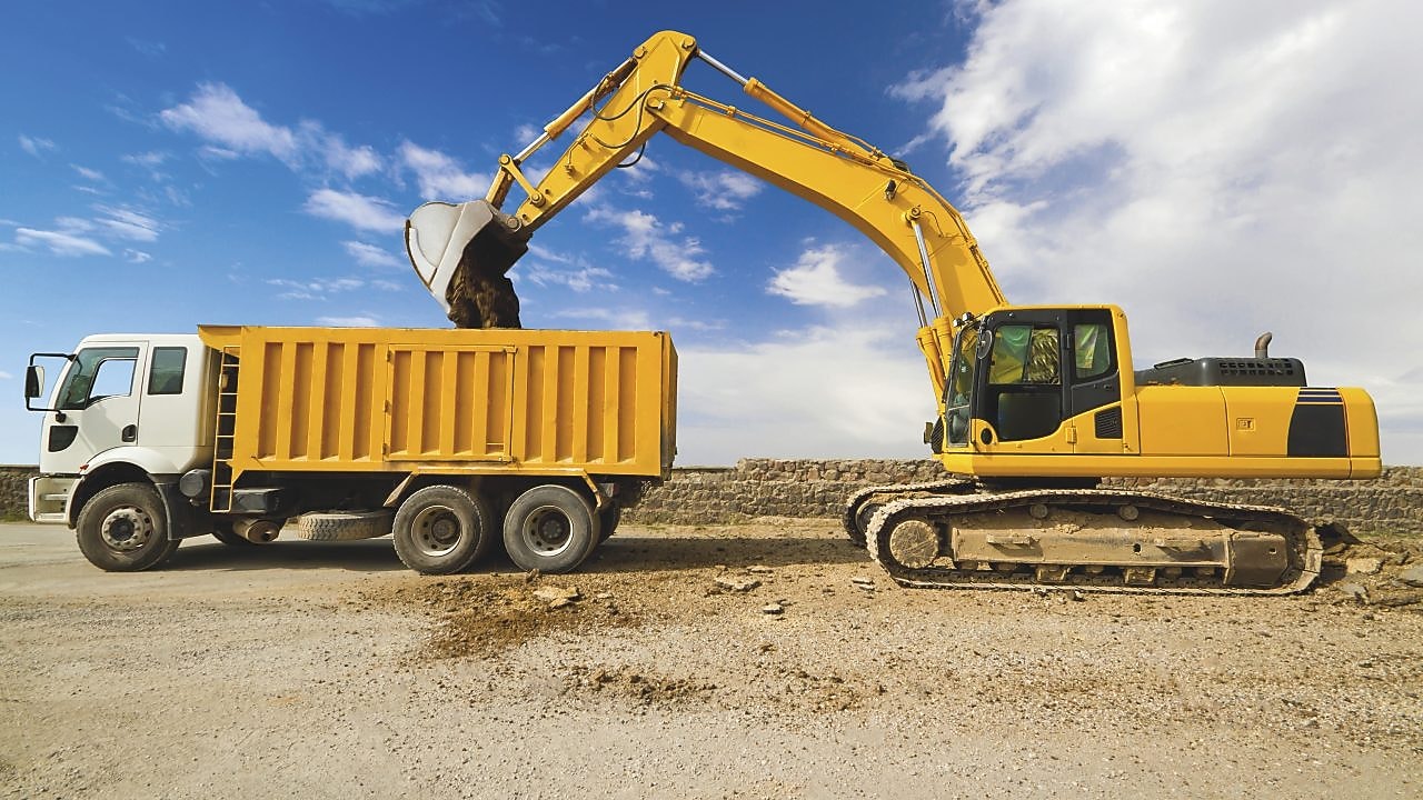 Excavator loading dumper truck