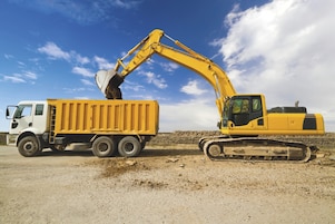 Excavator loading dumper truck