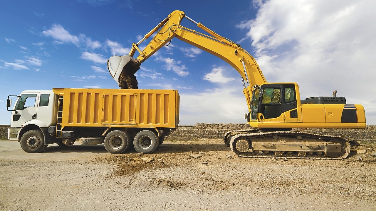 Excavator loading dumper truck