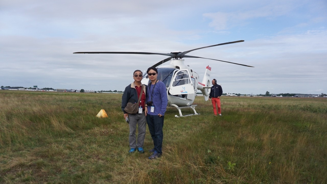 Two men near Helicopter